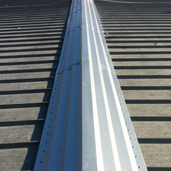 Extra wide metal ridge cap. It's a stair step design and is flexible and very strong.