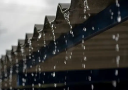 Rain on a metal roof, falling off the edge. Meant to illustrate noise associated with metal roofing and how to manage it for living spaces.